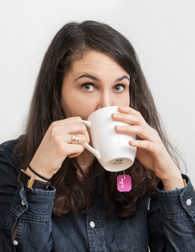 Cheeky woman drinking tea