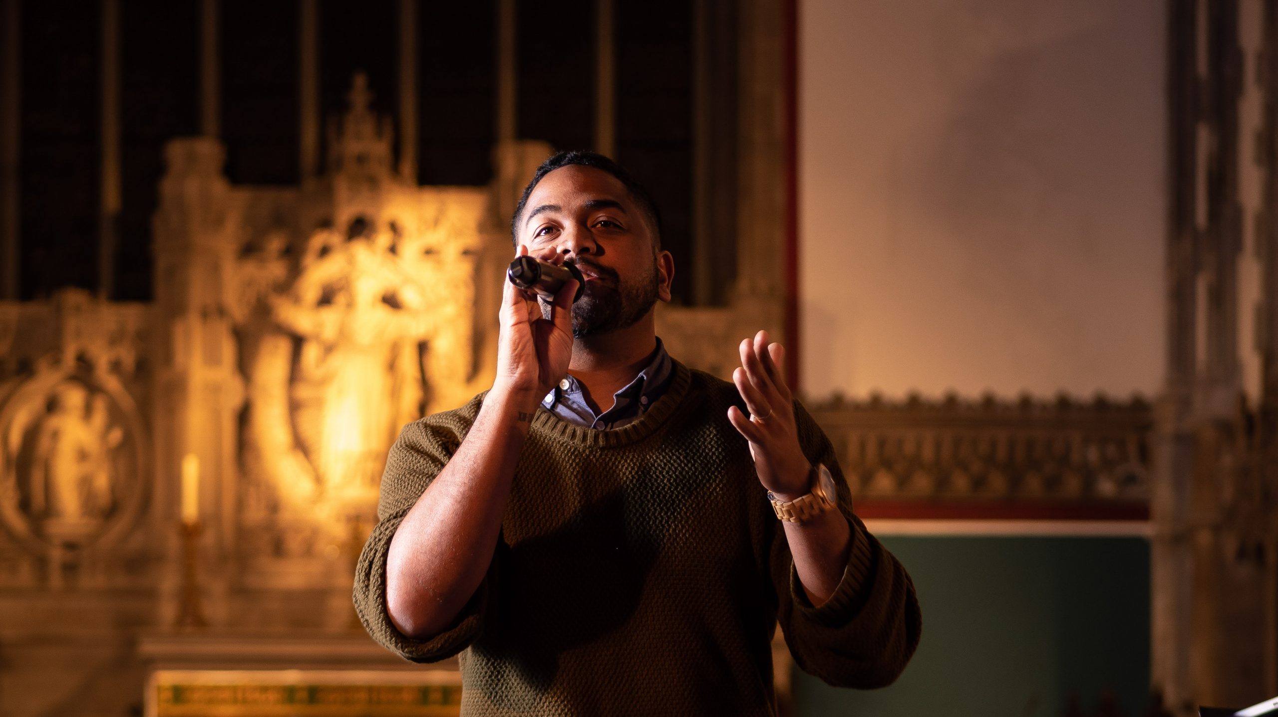 Visual aid: Male singer singing passionately in a church