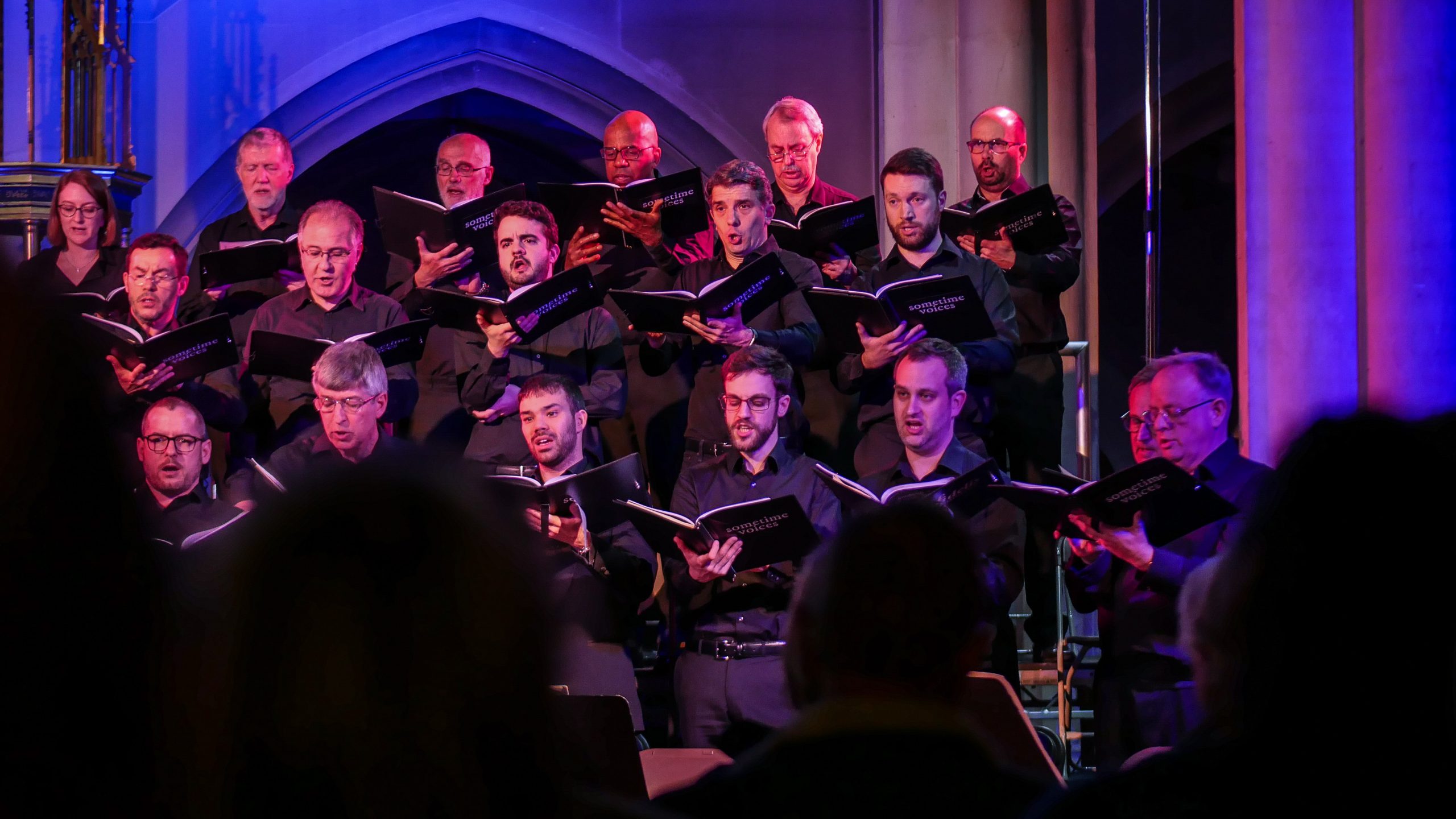 Visual aid: Part of the male choir during a classic music concert
