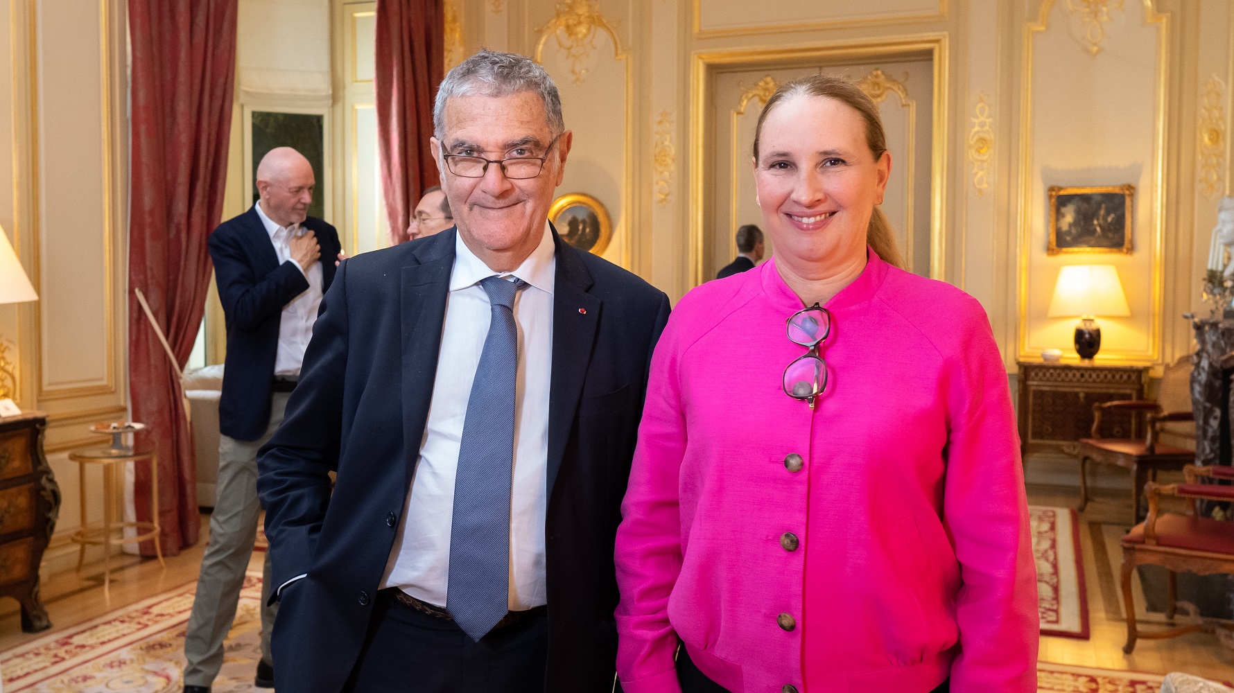 Visual aid: Nobel Prize Serge Haroche posing with a woman at an event at the French Embassy in London